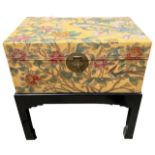 A 20TH CENTURY JAPANESE PAINTED LEATHER TRUNK ON EBONISED STAND Decorated with a parrot, exotic