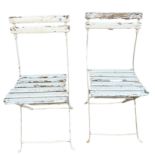 A PAIR OF 20TH CENTURY FRENCH PAINTED WOOD AND WROUGHT IRON FOLDING GARDEN CHAIRS.
