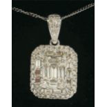 A LARGE PENDANT SET WITH ROUND BRILLIANT CUT AND BAGUETTE CUT DIAMONDS with a diamond bale set in