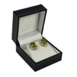 A PAIR OF YELLOW GOLD OVAL PERIDOT AND DIAMOND CLUSTER EARRINGS, Boxed. (Approx Peridot 4.80ct,