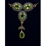 AN ORNATE NECKLACE SET WITH PERIDOT AND AMETHYST. Boxed