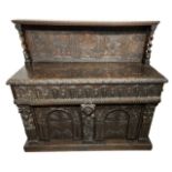 A 19TH CENTURY CARVED OAK JACOBEAN DESIGN SIDEBOARD The carved panel back above a single drawer