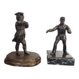 A 19TH CENTURY CAST BRONZE FIGURE OF A LITTLE BOY IN 18TH CENTURY DRESS Together with an early