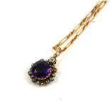A VICTORIAN YELLOW METAL, AMETHYST AND DIAMOND PENDANT, TOGETHER WITH A 15CT GOLD TROMBONE LINK