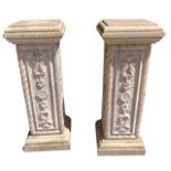 A PAIR OF DECORATIVE CARVED MARBLE PLINTHS Decorated with flowerheads and leaves. (h 79.5cm x 30cm x