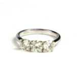 A 18CT WHITE GOLD DIAMOND TRILOGY RING with WGI certificate. (diamonds 1.50ct)