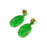A PAIR OF 18CT GOLD AND JADE DROP EARRINGS Having a carved and partial pierced decoration to
