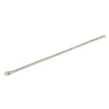 A PLATINUM AND ROUND BRILLIANT CUT DIAMOND TENNIS BRACELET Boxed. (diamonds 5.05ct)