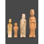 A GROUP OF FOUR POTTERY FIGURES, 4TH/5TH CENTURY Including three figures of officials, one of them