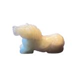 AN 18TH/19TH CENTURY CHINESE PALE CELADON JADE CARVING OF A HORSE The recumbent horse depicted