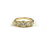 AN 18CT GOLD AND GRADUATED FIVE STONE DIAMOND RING with WGI Certificate (diamonds 1.59ct)