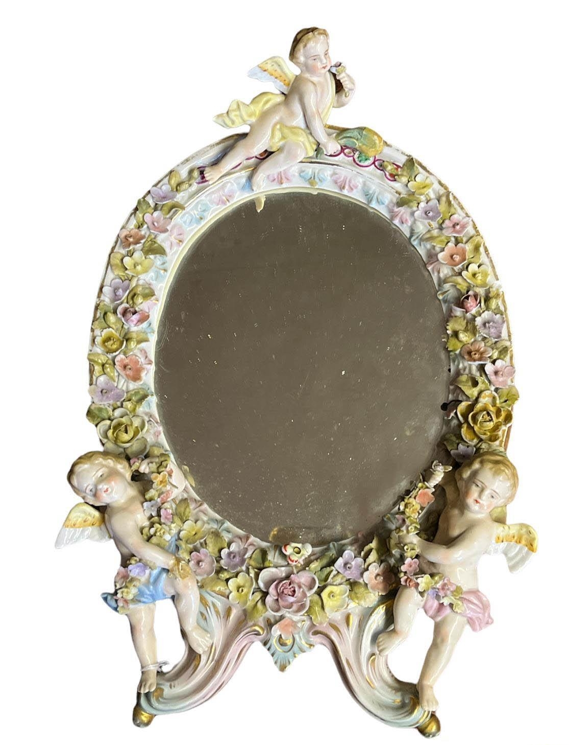 THURINGIAN, SITZENDORF, A LATE 19TH CENTURY CHERUB MIRROR A ladies? hard paste porcelain table