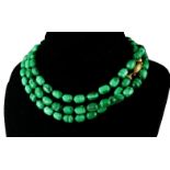 AN 18CT GOLD CLASPED MALACHITE BARREL BEAD NECKLACE. (58.5cm)