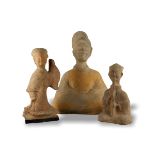 THREE SICHUAN POTTERY FIGURES, HAN DYNASTY, BC 206 - AD 220 The unglazed redware figures