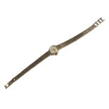 ROLEX, PRECISION, A 9CT GOLD LADIES’ WRISTWATCH Having a textured design link strap and embossed
