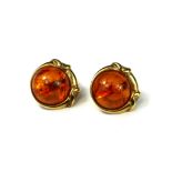 A PAIR OF 9CT GOLD AND CABOCHON AMBER EARRINGS The central round Baltic amber approximately 14mm