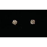 A PAIR OF 18CT ROSE GOLD FOUR CLAW SOLITAIRE DIAMOND STUDS Boxed. (diamond total 0.44ct)