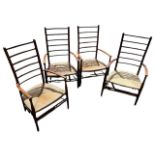 LIBERTY & CO. ARTS & CRAFTS, A SET OF FOUR LOW LADDER BACK ARMCHAIRS With rush seats. N.B. an