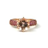A 9CT ROSE GOLD, ROUND CUT MORGANITE AND PINK TOURMALINE RING. (morganite approx weight 3.2ct, gross