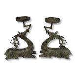 A PAIR OF CHINESE SHANG ZHOU DYNASTY STYLE BRONZE STAG CANDLESTICKS Kneeling down, candlestick