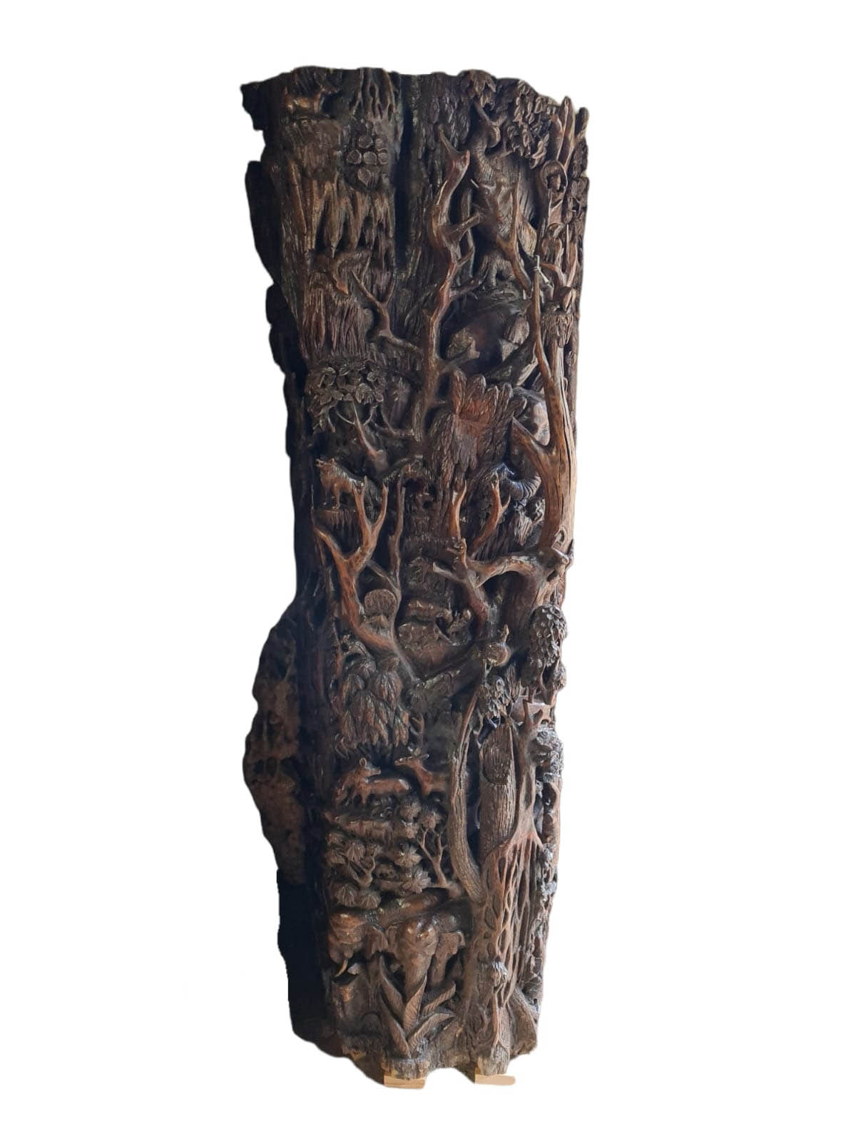 A LARGE AND IMPRESSIVE HEAVILY AND FINELY CARVED BURMESE TEAK TREE TRUNK with flora and fauna,