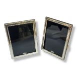 A PAIR OF SILVER PHOTOGRAPH FRAMES London hallmark, the rectangular Sterling silver frame