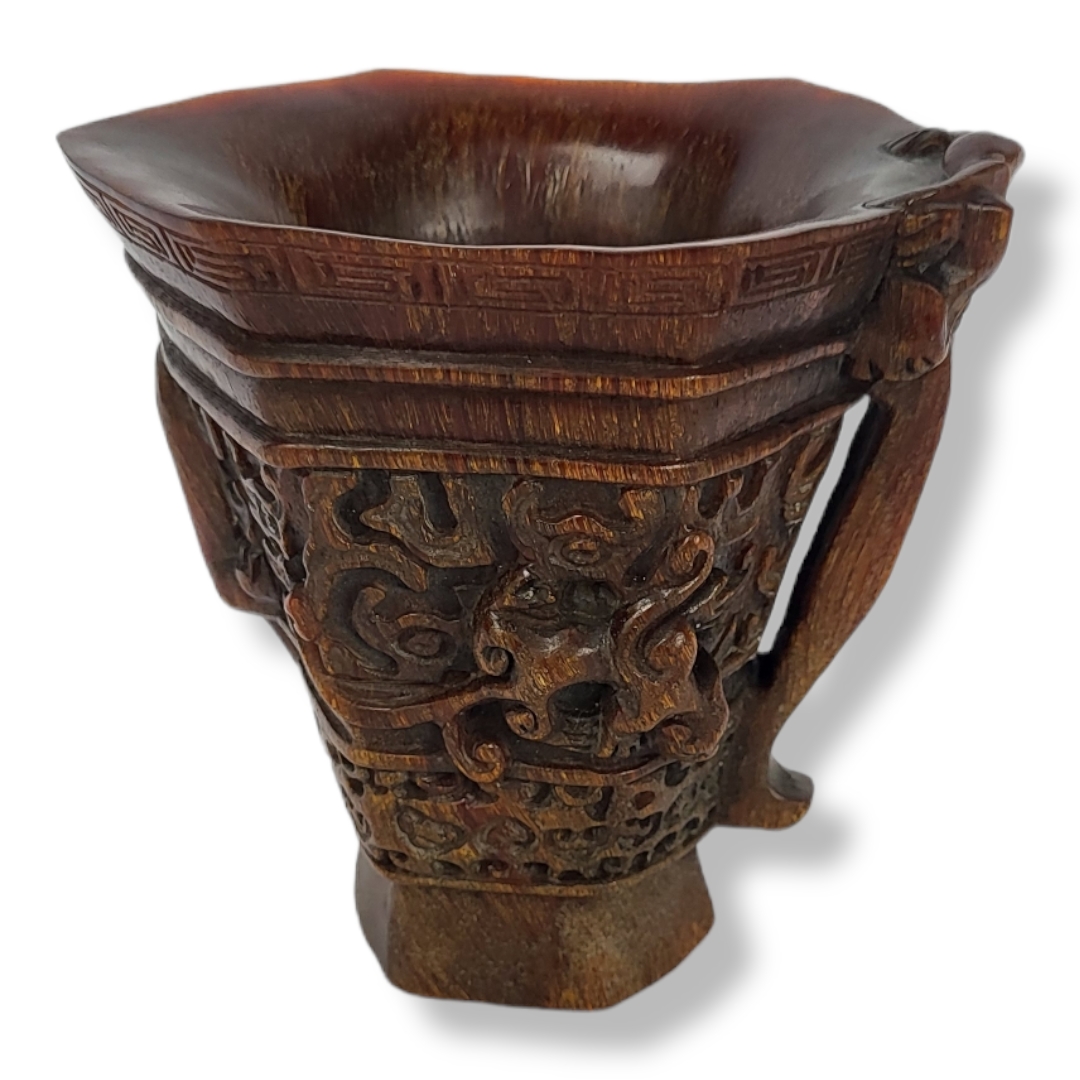 A CHINESE CARVED LIBATION CUP (h 13cm x diameter 12cm) Condition: good