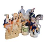 A COLLECTION OF 19TH CENTURY STAFFORDSHIRE POTTERY FLATBACK FIGURES Comprising two equestrian