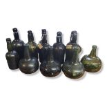 A COLLECTION OF 18TH/19TH CENTURY AND LATER GREEN GLASS WINE BOTTLES To include four ships mallet