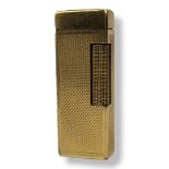 WITHDRAWN DUNHILL, A VINTAGE 18CT GOLD RECTANGULAR CIGARETTE LIGHTER With engine turned decoration.