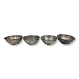 A SET OF FOUR VINTAGE CONTINENTAL SILVER SPHERICAL BOWLS With fine engraved decoration of Ancient