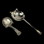 A GEORGIAN SILVER TEA CADDY SPOON Having scroll and shell decoration to handle and engraved floral