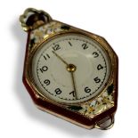 DIEL, AN EARLY 20TH CENTURY 14CT GOLD AND ENAMEL LADIES’ PENDANT WATCH Lozenge form with silver tone