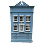 A CHILDS PAINTED WARDROBE IN THE FORM OF A GEORGIAN DOLLS HOUSE In blue and white with two doors