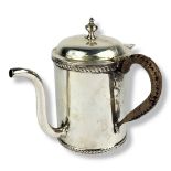 ASPREY, AN EARLY 20TH CENTURY SILVER ARGYLE GRAVY WARMER Having a hinged lid, wicker handle and