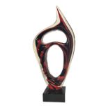 A MID CENTURY ITALIAN ART GLASS ABSTRACT SCULPTURE The interior applied in flambé reds and blacks