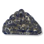 A CARVED LAPIS LAZULI BOULDER Depicting a village built on the downslope of a mountain, a detailed