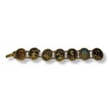 A 19TH CENTURY JAPANESE BRONZE AND YELLOW METAL 'SHAKUDO' BRACELET Oval form panels with traditional