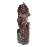 A LARGE WOOD CARVING OF GUANYIN-BUDDHIST GODDESS OF MERCY Depicted standing in the sea with fish