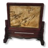 A 19TH CENTURY TIBETAN NATURAL STONE PAINTING, SIGNED, A LAOJUN (GOOD LUCK) Set in a hardwood