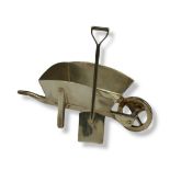 WILLIAM COMYNS, A VINTAGE SILVER NOVELTY WHEELBARROW AND SPADE Plain form, with articulated wheel,