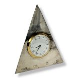 A NOVELTY HALLMARKED SILVER PYRAMID FORM TABLE CLOCK Having an enamelled white dial and Roman