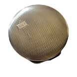 AN ART DECO SILVER POWDER SPHERICAL COMPACT With engine turned decoration, having mirror set to