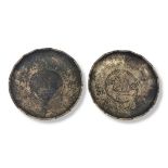 A PAIR OF CHINESE REPUBLIC SILVER COIN SET DISHES Each set with a Sun Yat Sen silver dollar, year 21
