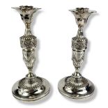 A PAIR OF LATE 19TH/EARLY 20TH CENTURY CLASSICAL FORM CONTINENTAL WHITE METAL CANDLESTICKS