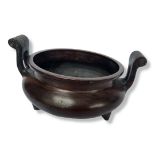 A CHINESE TWO HANDLES TRIPOD BRONZE CIRCULAR CENSER. (h 13.5cm x diameter 19cm) Condition: good