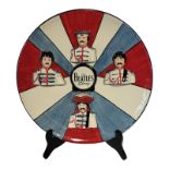LORNA BAILEY, ‘THE BEATLES STORY’, A CIRCULAR POTTERY WALL CHARGER Front decorated with