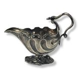 A LATE 18TH/EARLY 19TH CENTURY CONTINENTAL WHITE METAL CREAM JUG Rococo shell form with serpent