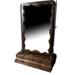 A 19TH CENTURY MAHOGANY AND PARCEL GILT TOILET MIRROR With three convex trinket drawers. (46cm x