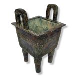 A BRONZE ARCHAIC STYLE CHINESE SQUARE KORO With two raised handles, decorated with Chinese
